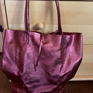 Used once. Mint condition tote. A beautiful metallic burgundy.